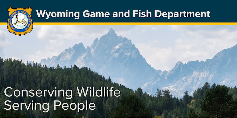 A mountain scene with the Game and Fish mission statement